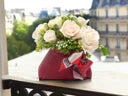 White Roses in Red Bag